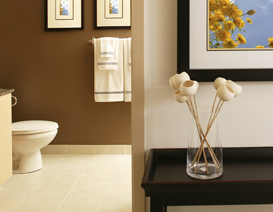 Interior view of a flower vase on a table with a half-view of a home's bathroom